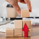 Chris standing up holding his daughter Elva